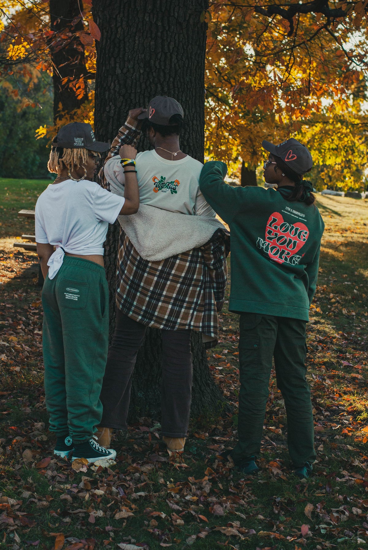 Lifestyle photo of models wearing pieces from the We Us collection.