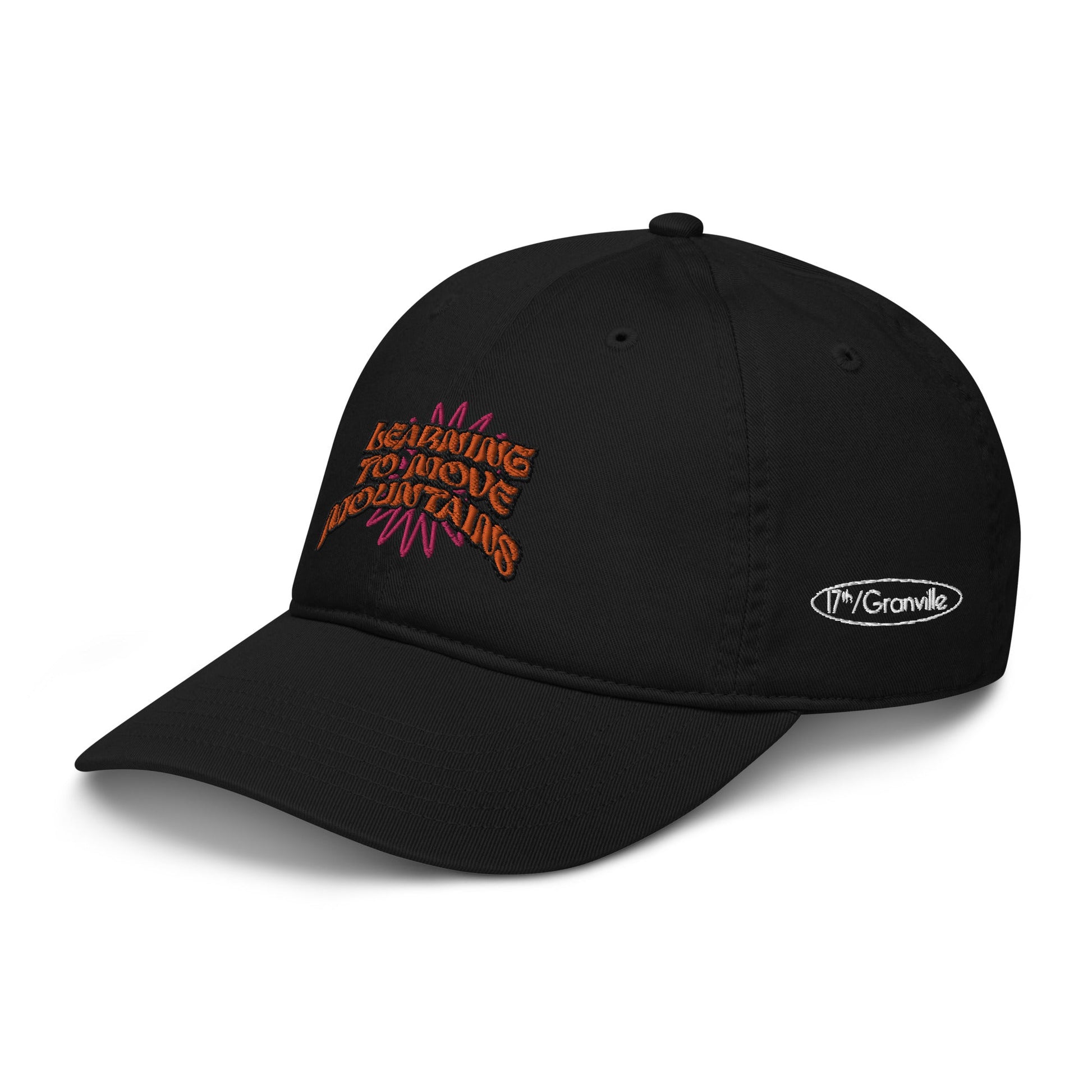 This black embroidered hat, created from organic cotton, showcases vibrant embroidery with the phrase "Learning to Move Mountains" in orange and pink. The side is adorned with a small white Eintou logo along with the text 17th & Granville.
