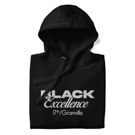 a fold black hoodie featuring white text embroidered on the front chest "Black Excellence" and "17th and Granville"