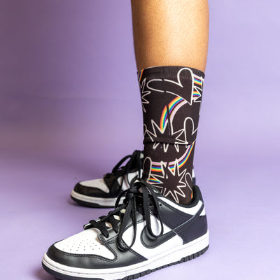 Blooming Pride socks featuring a colorful floral pride design.