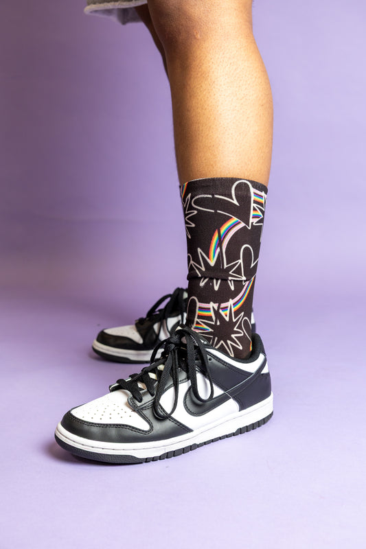 Blooming Pride socks featuring a colorful floral pride design.