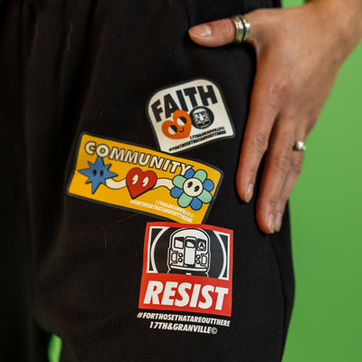 Close up of the Faith Community and Resistance design on the sweatpants.