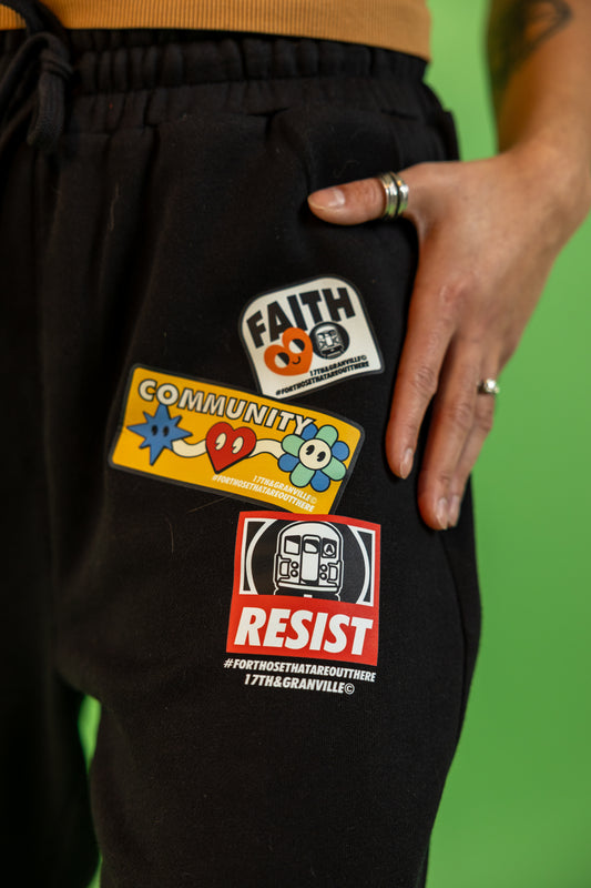 Close up of the Faith Community and Resistance design on the sweatpants.