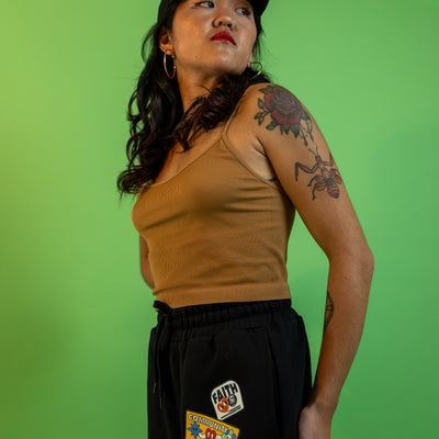 Model wearing the Faith Community and Resistance sweatpants.