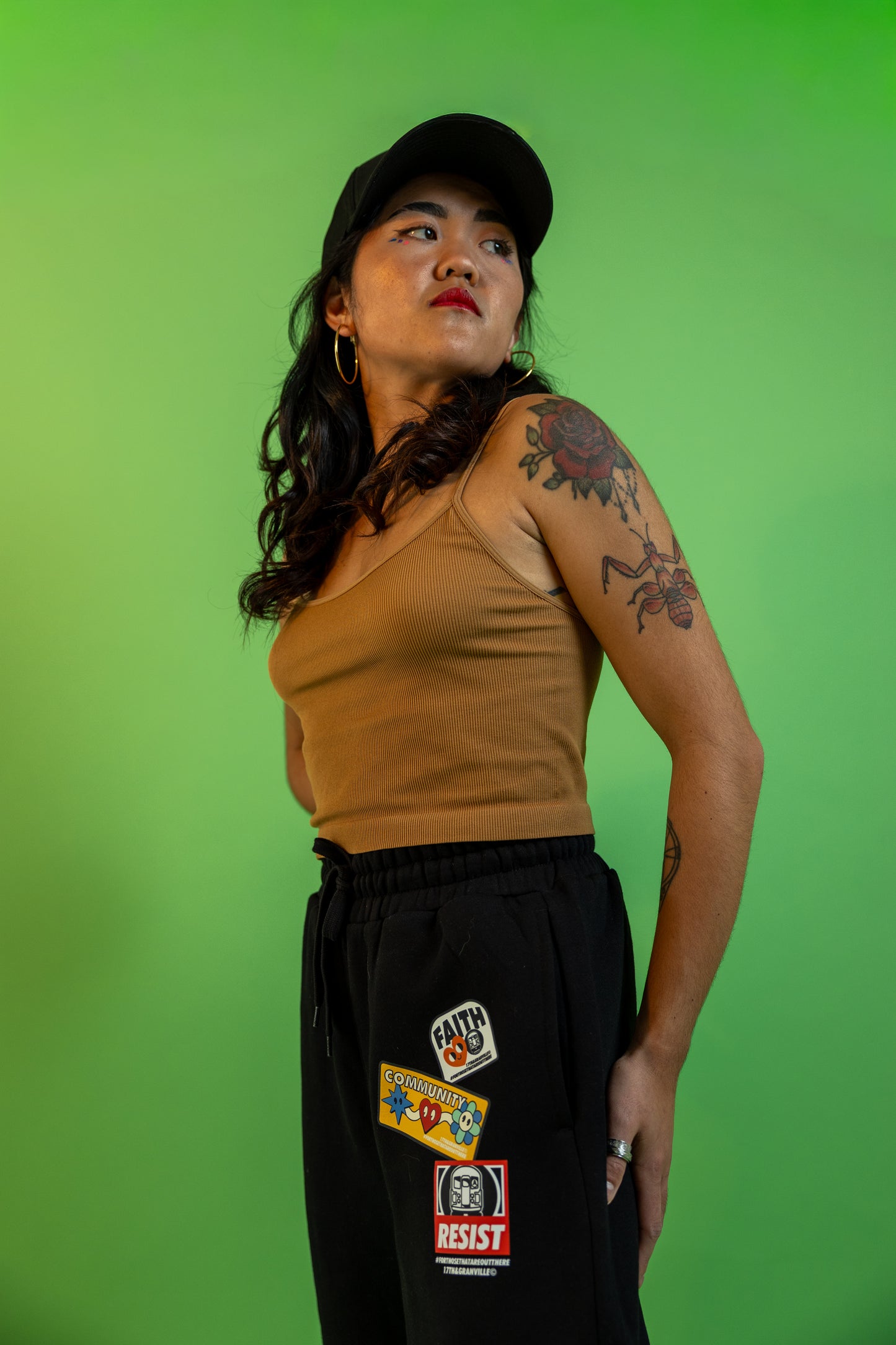 Model wearing the Faith Community and Resistance sweatpants.