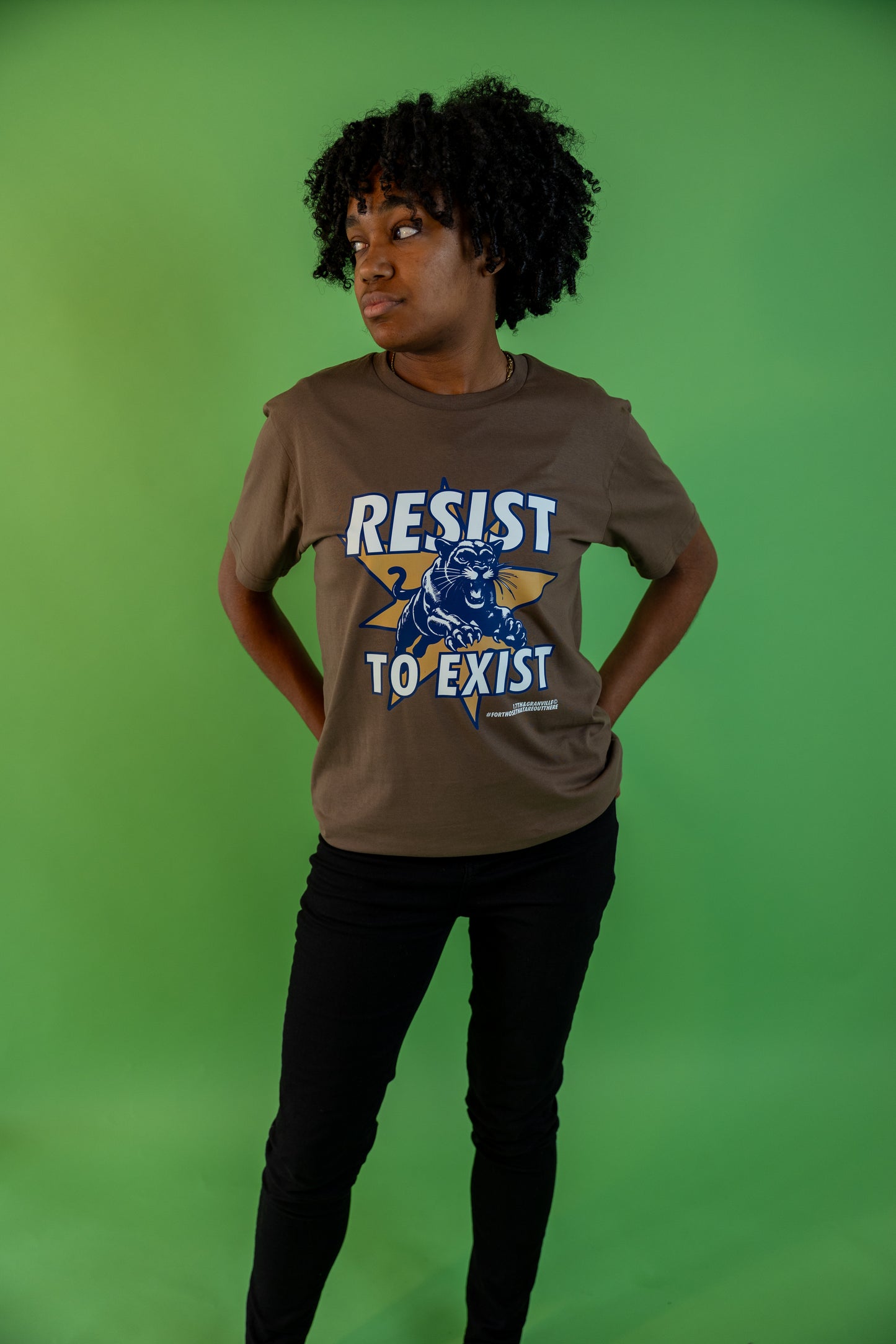 Full body photo of a model wearing the Resist tee.