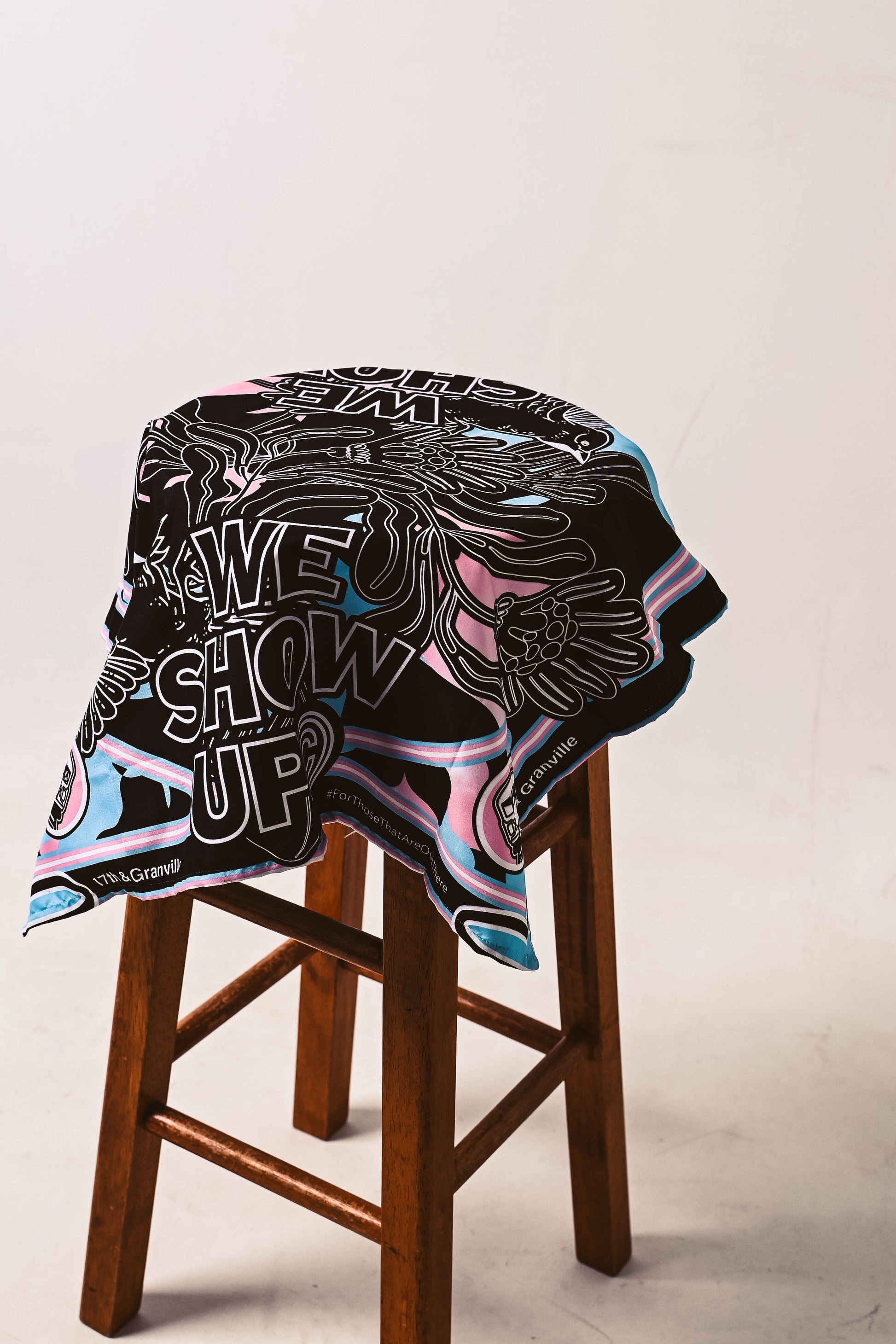 Trans Pride Bandana on a stool featuring the colors of the trans pride flag