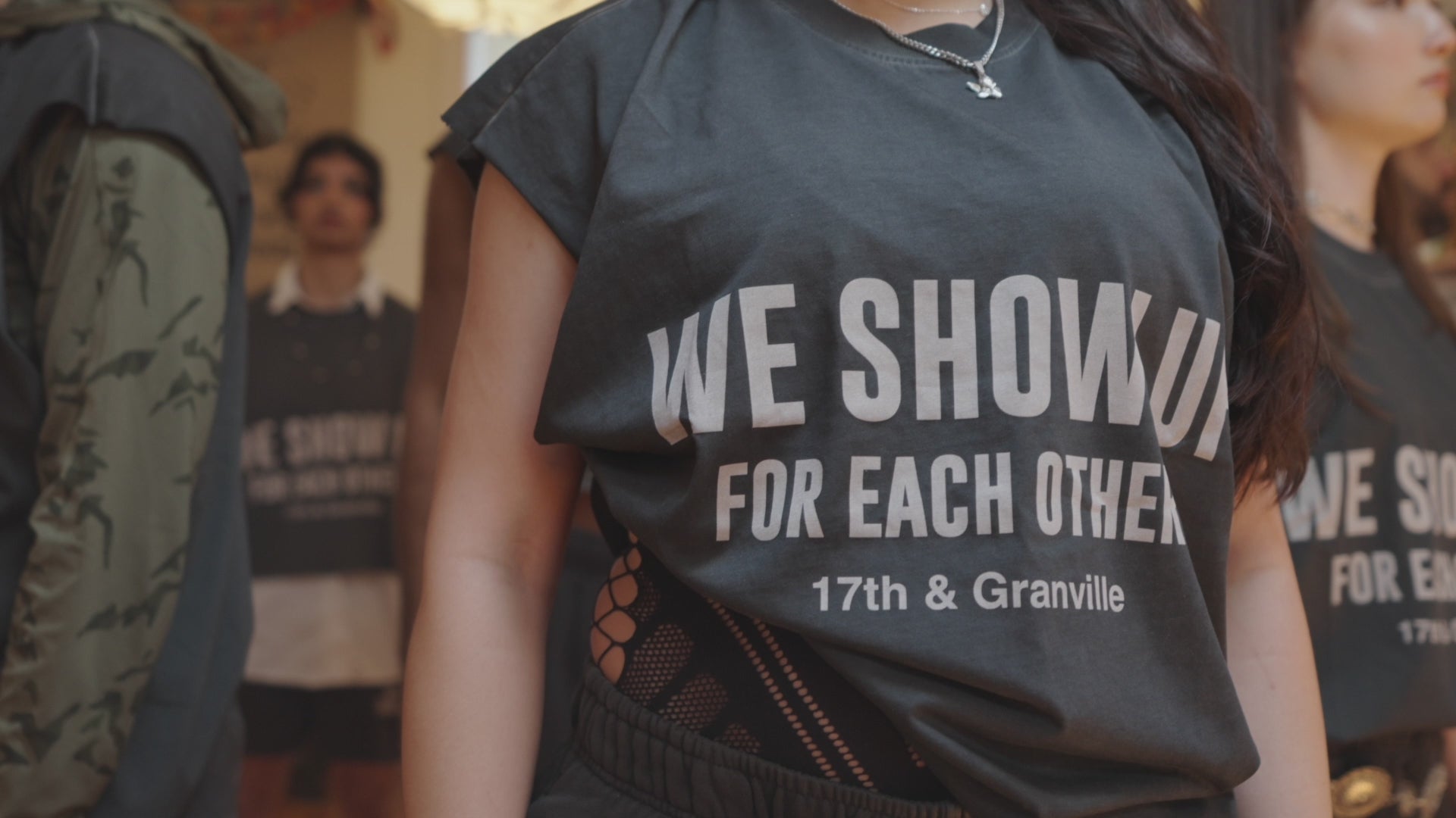 Load video: Dancers perform together in 17th &amp; Granville’s We Show Up campaign video, celebrating LGBTQ+ visibility, self-expression, joy, and community through movement and fashion.